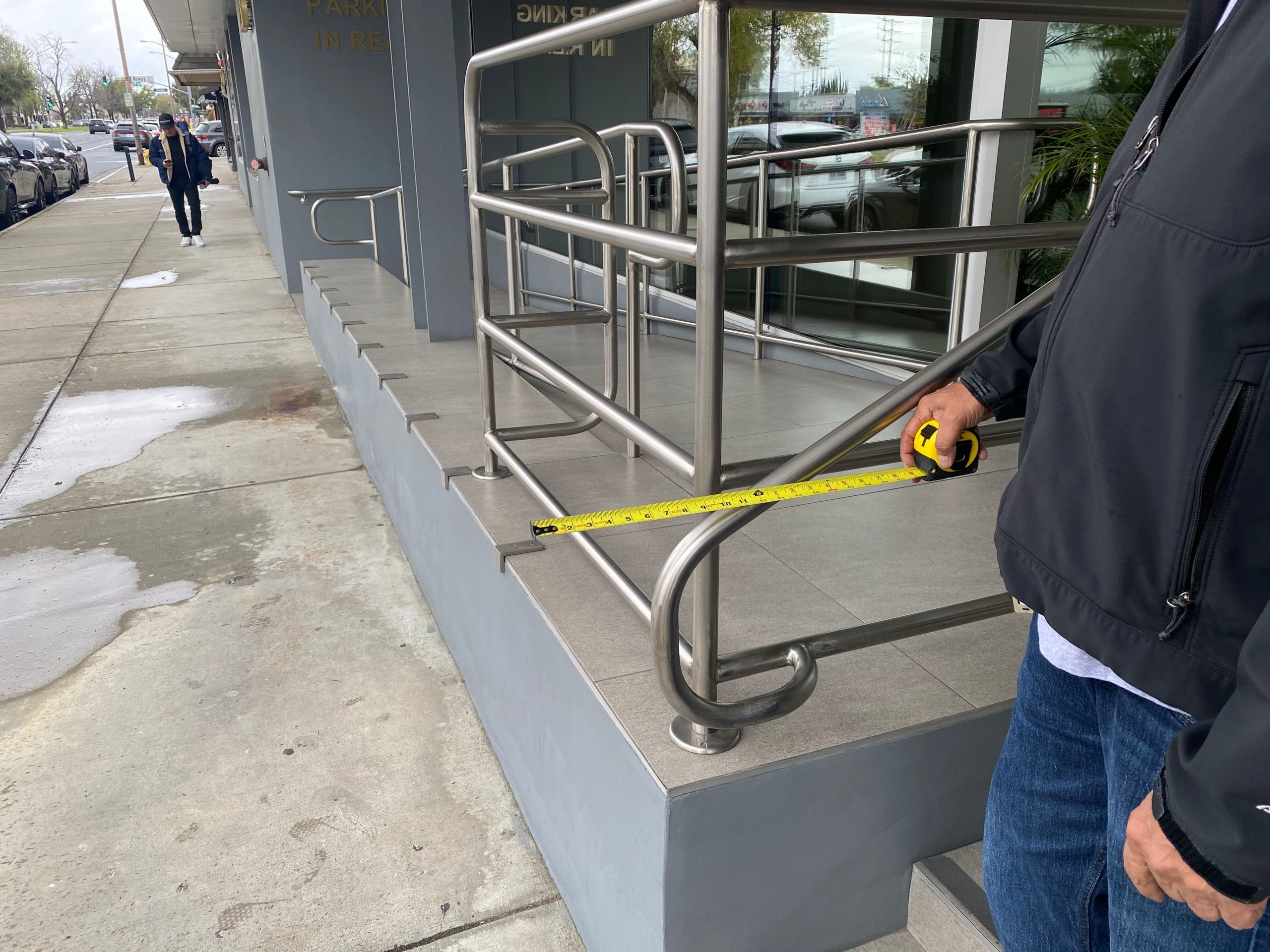 CASp inspector measuring a doorway to confirm it is ADA compliant
